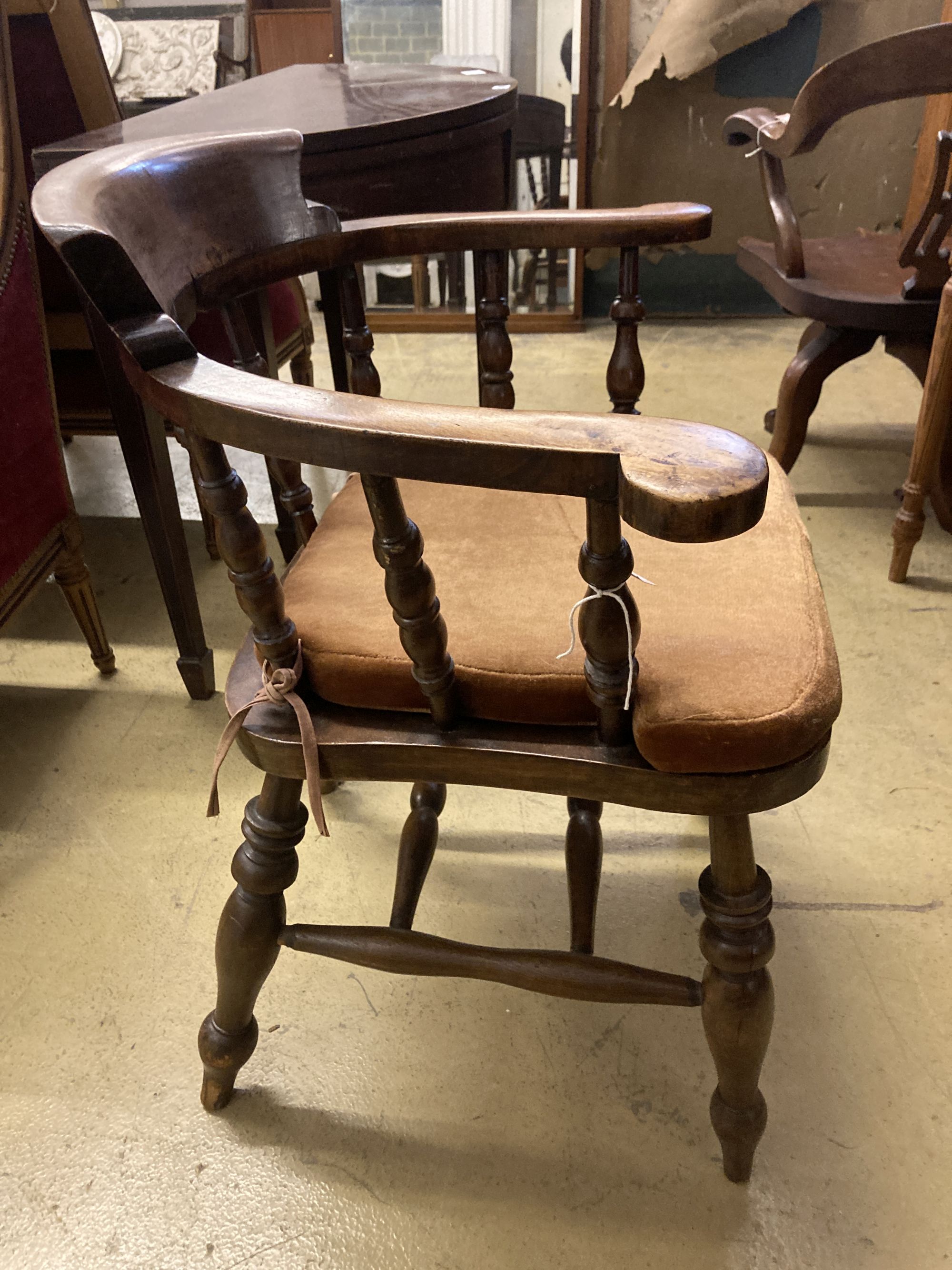 A late Victorian beech smokers bow elbow chair, width 67cm, depth 48cm, height 82cm